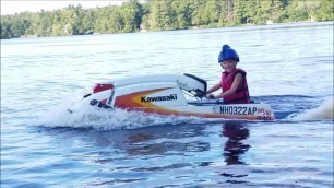 'Kid Rips it up Stand up on Built Jet Ski'