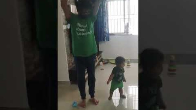 'Baby teaches exercises to dad funny'