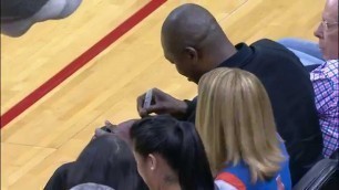 'Rockets Fan Catches Hakeem-Autographed Ball, Gives to Kid'