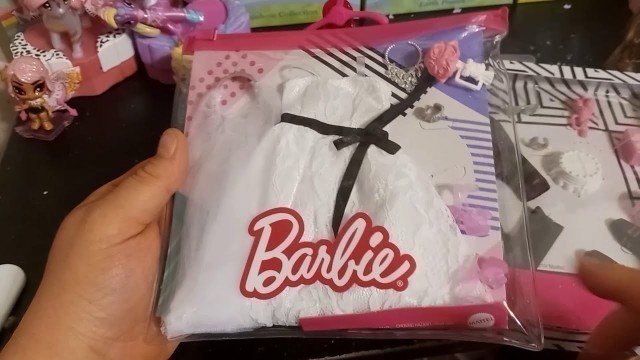 'Showing off Barbie and Ken wedding fashion packs'