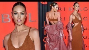 'Candice Swanepoel layers on the glamour in a backless cut-out knit dress at Bulgari\'s New York Fashi'