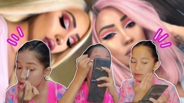 'doing the ‘BARBIE MAKEUP LOOK’!